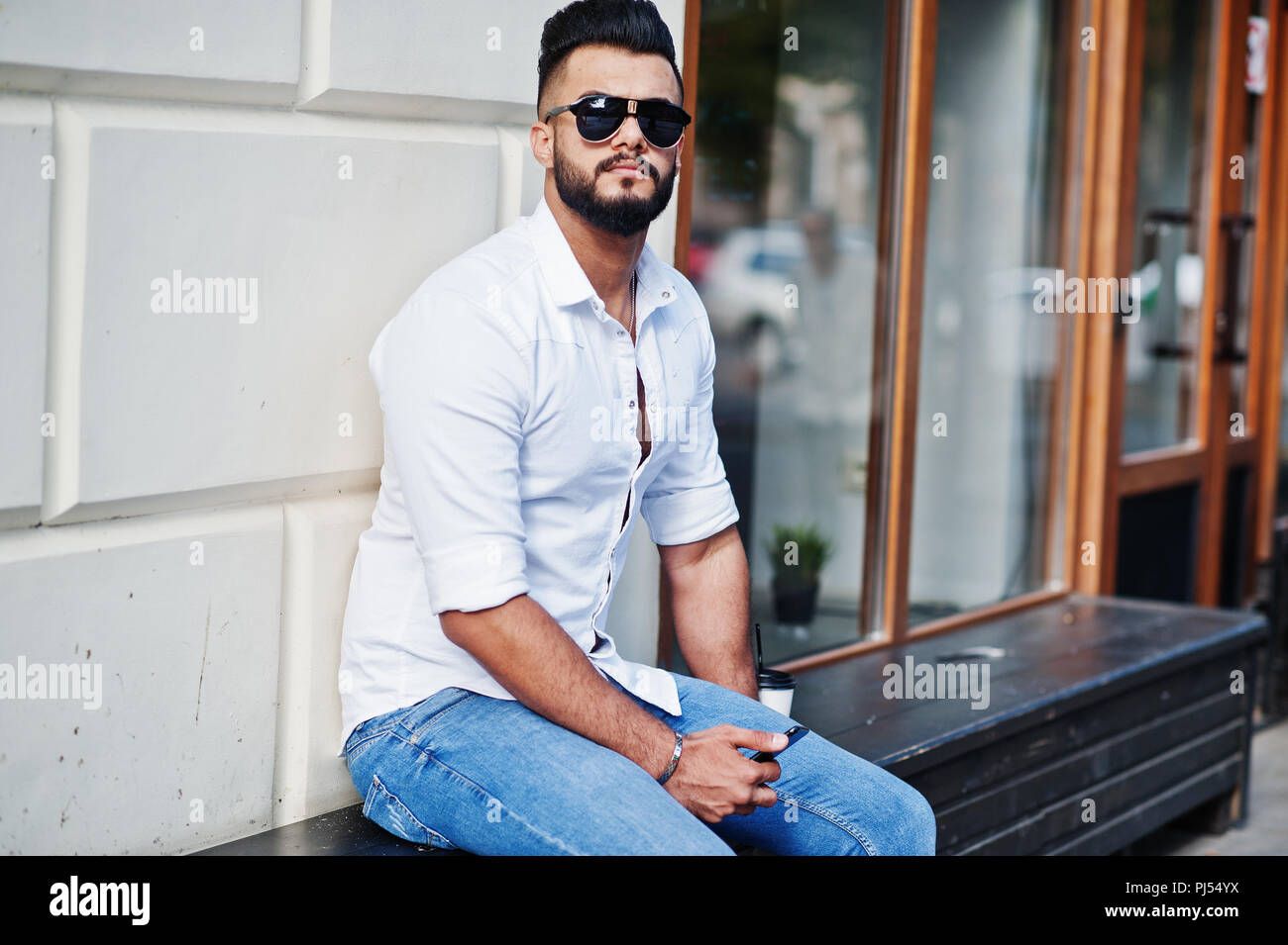 Stylish tall arabian man model in white 