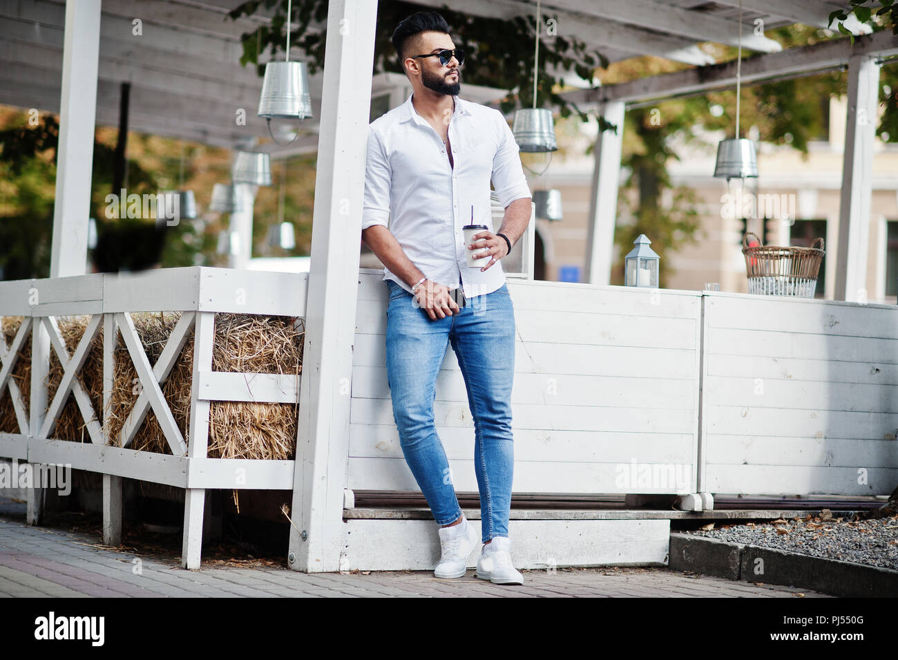 Stylish tall arabian man model in white 