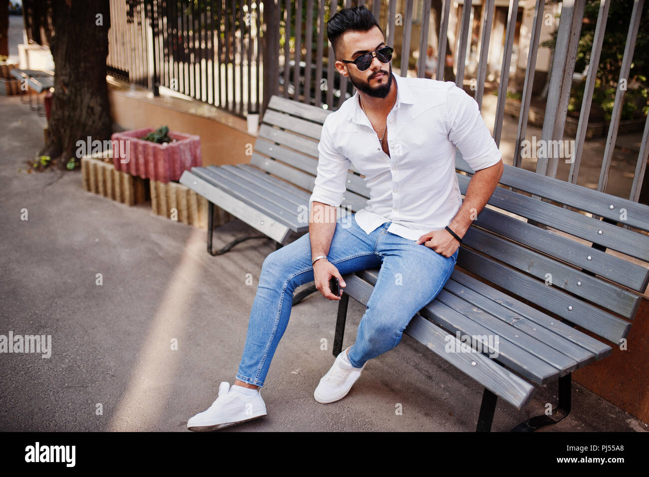 Stylish Tall Arabian Man Model In White Shirt Jeans And