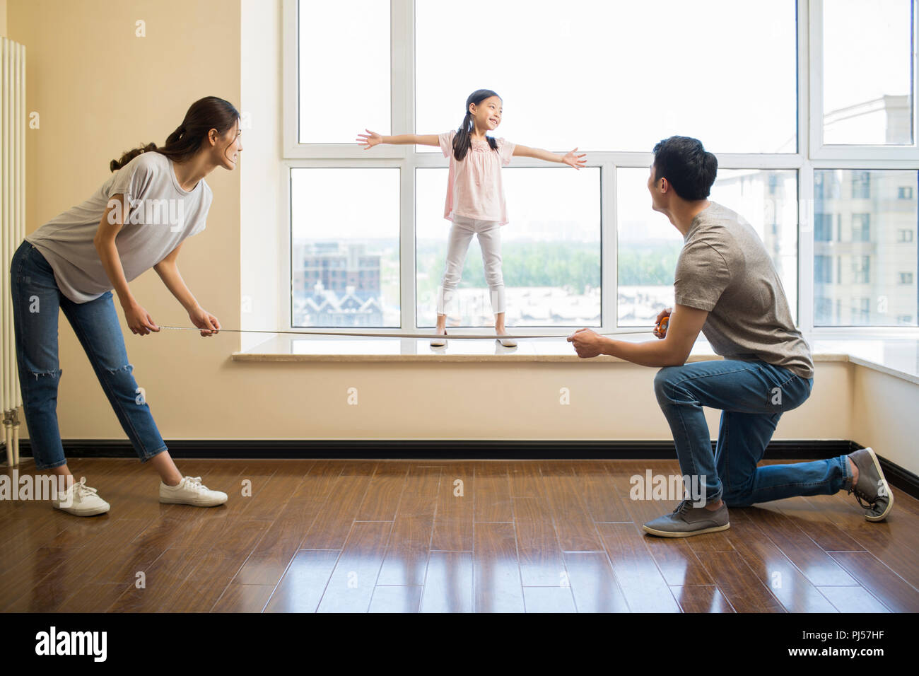 Happy Young Family Working On Home Renovation Stock Photo Alamy