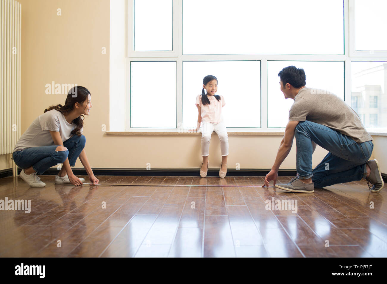 Happy Young Family Working On Home Renovation Stock Photo Alamy