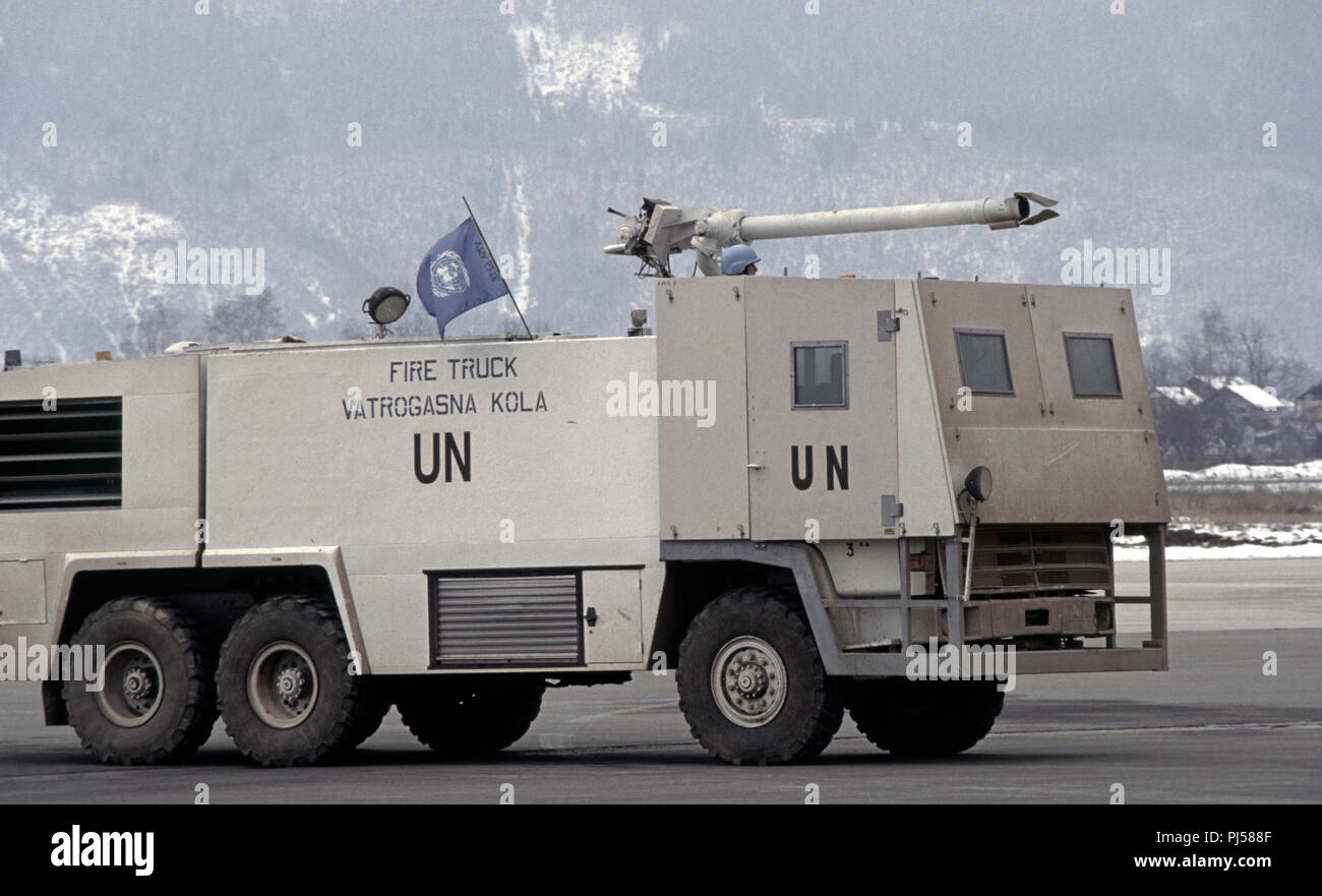 8th March 1993 During the Siege of Sarajevo: a United Nations fire truck at Sarajevo Airport, operated by French UN soldiers. The front end, where the driver and hose operator sit, is armoured. Stock Photo