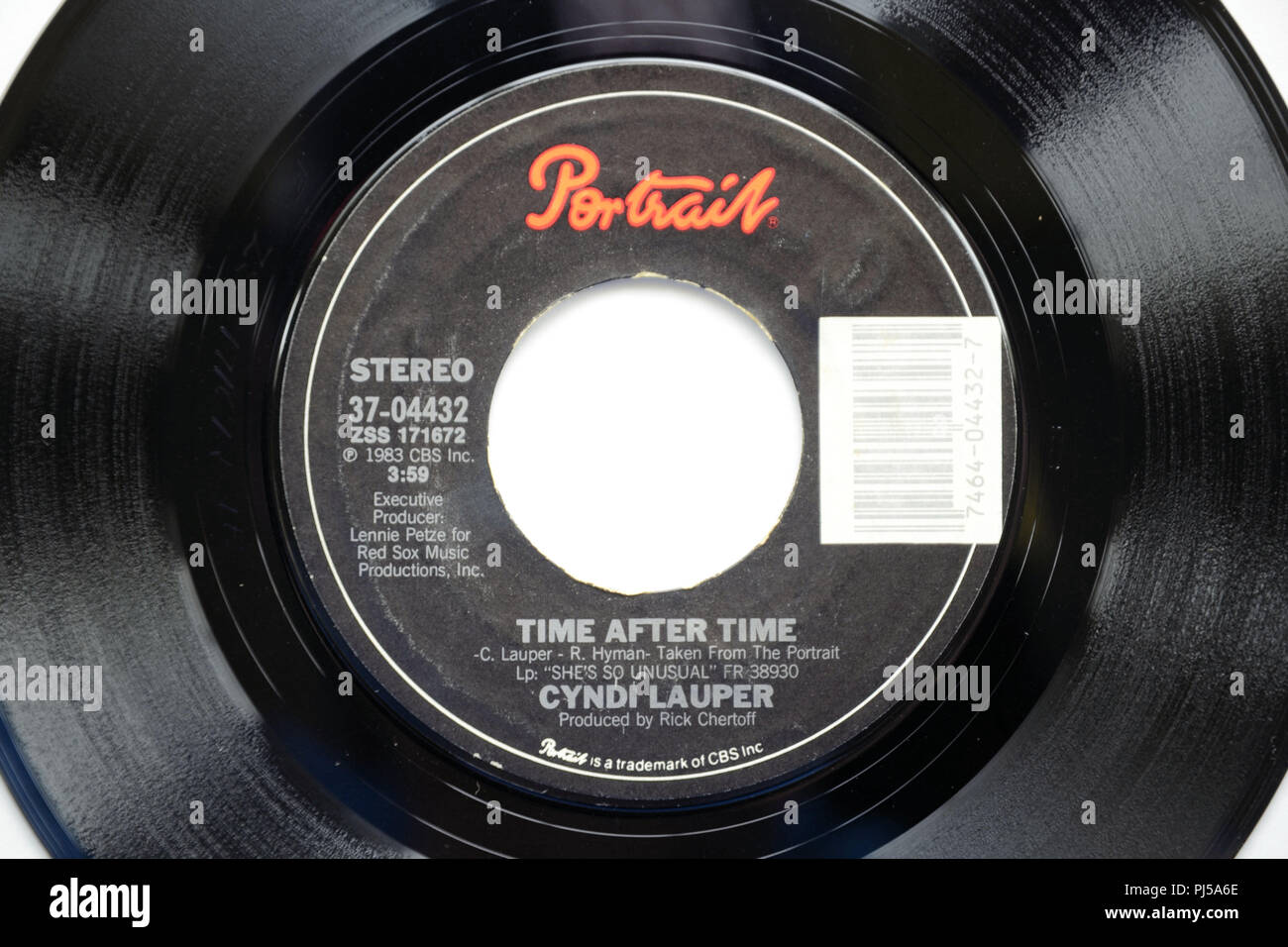Close-up of 45 RPM vinyl record of Cyndi Lauper's song 'Time after Time' released in 1983 by Portrait Records. Stock Photo