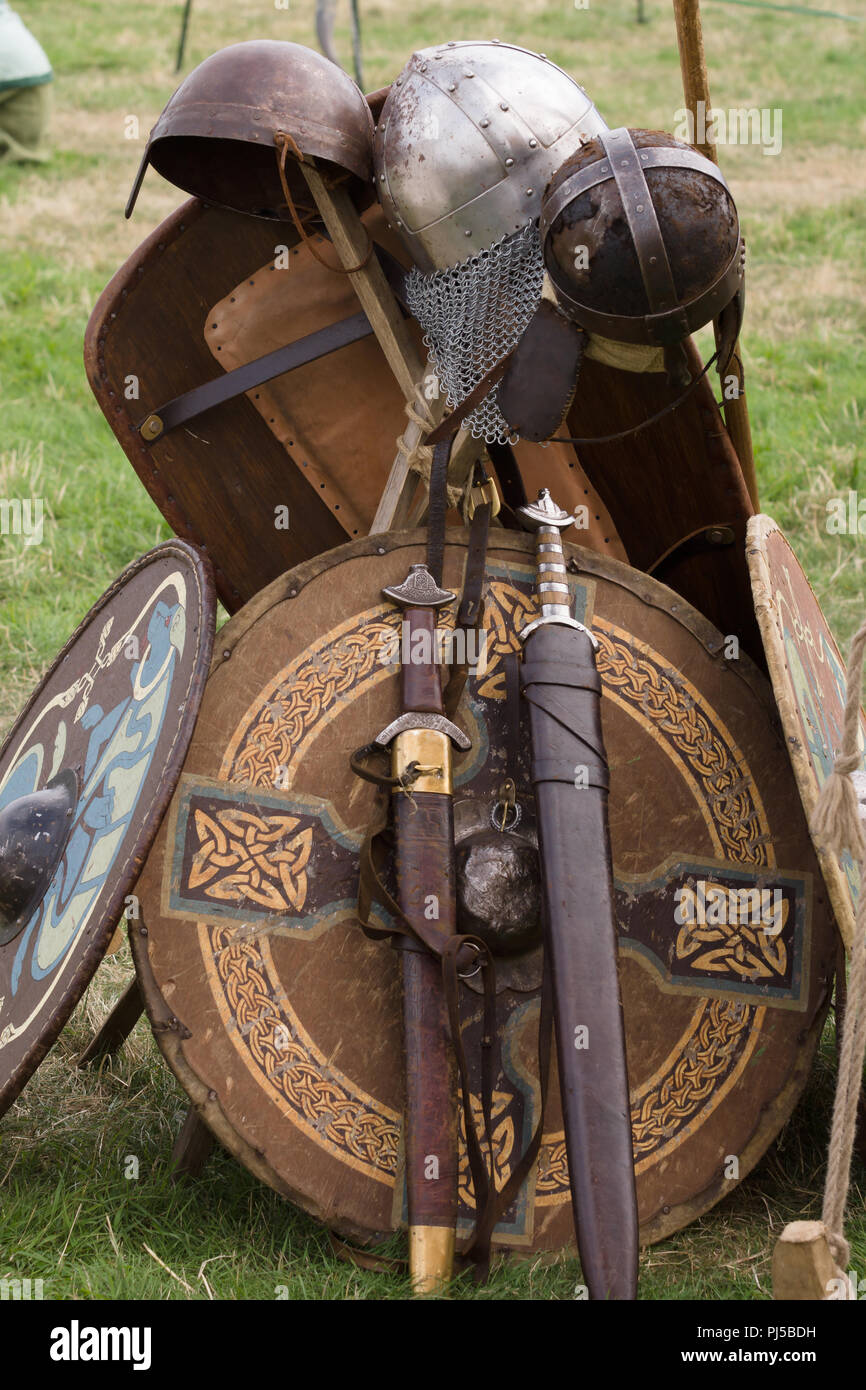 Medieval swords and shields stacked at a re-enactment of the battle of Crogen 1165 by the Cwmwd Ial society  in Chirk North Wales 2018 Stock Photo