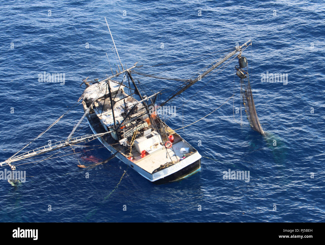 The fishing vessel Master D on fire approximately 40 miles east of Port  Isabel, Texas, Aug. 31, 2018. All three crewmembers from the fishing vessel  were rescued by the crew of the