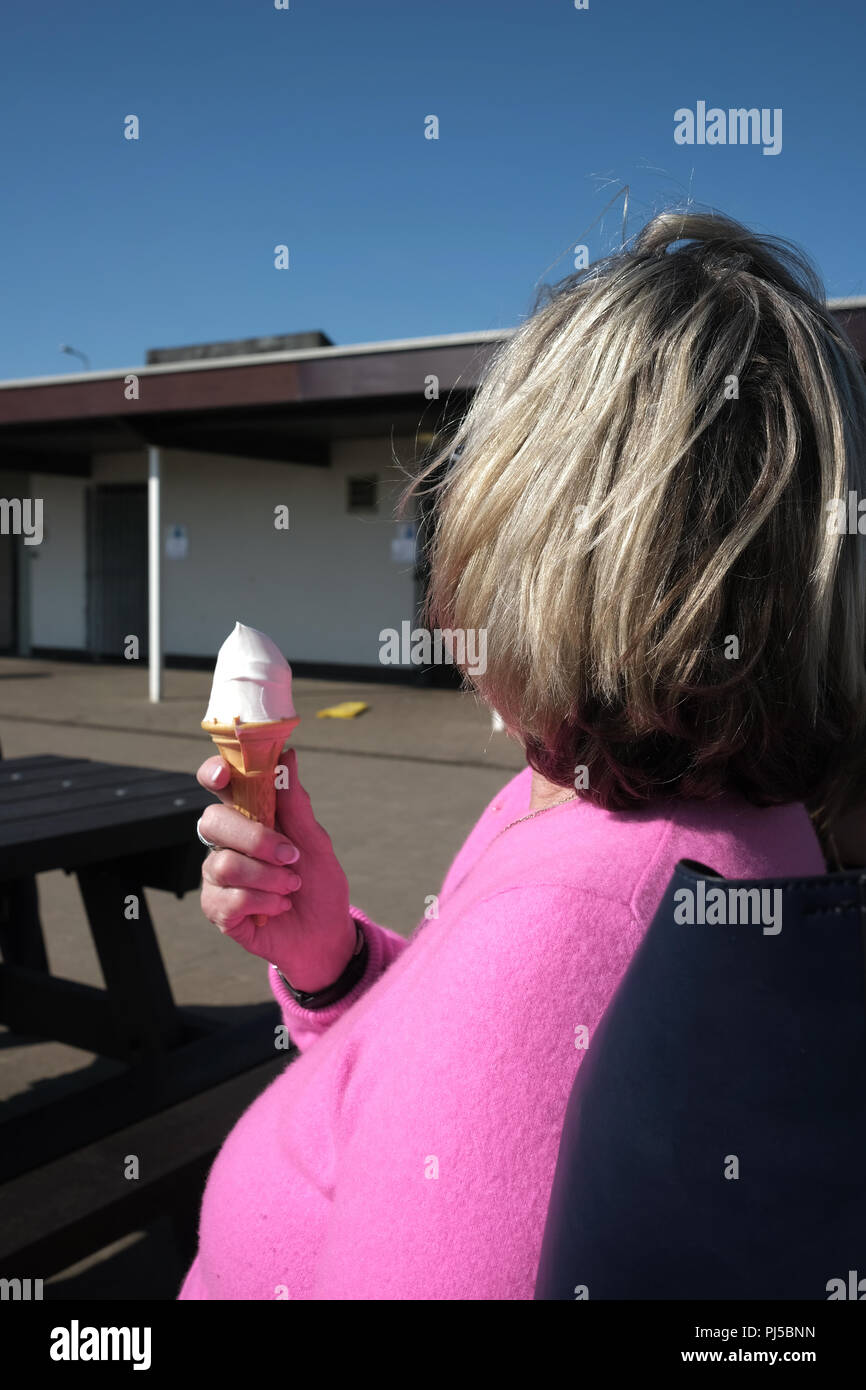 Woman eating ice cream fat hires stock photography and images Alamy