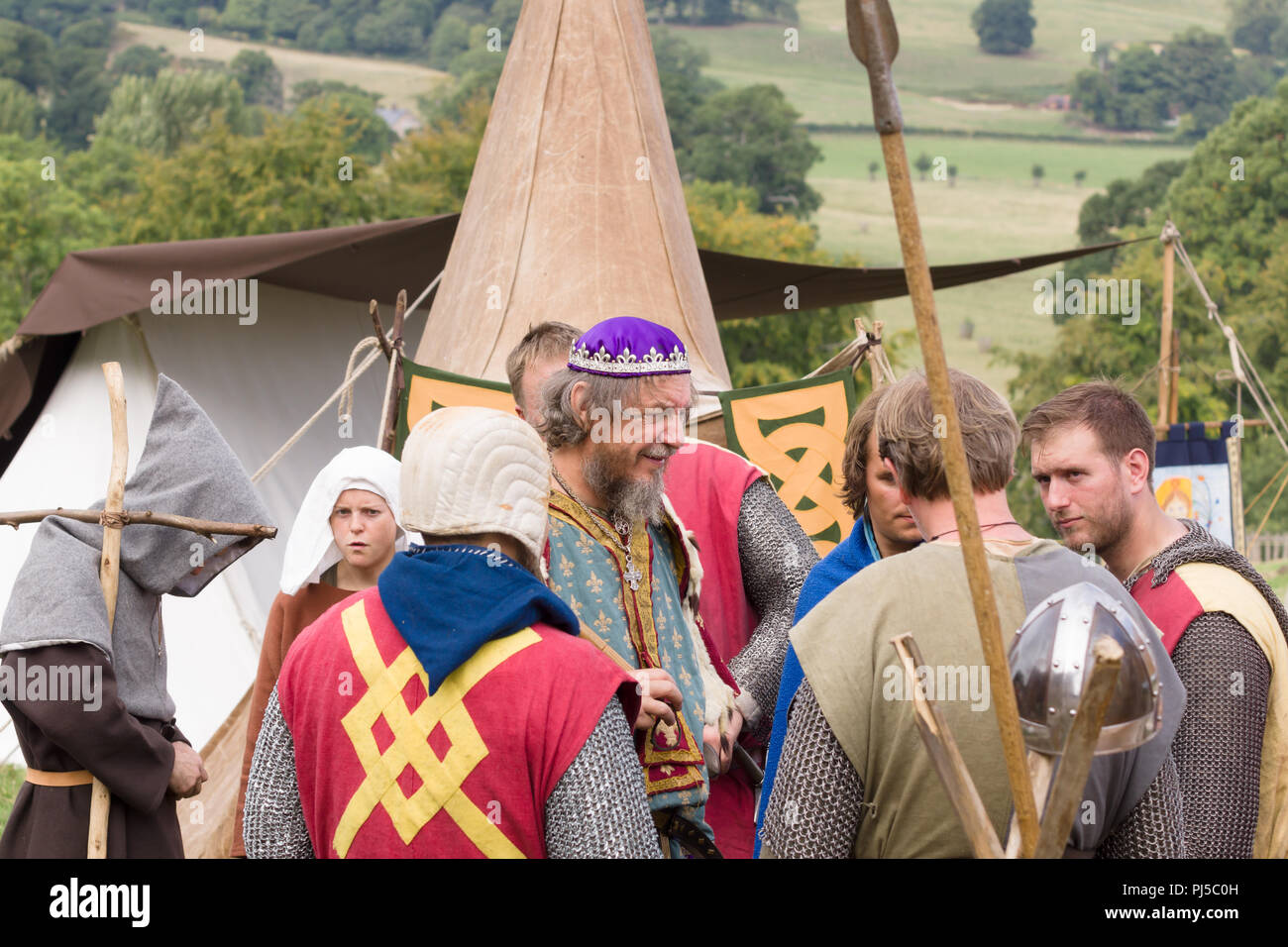 Medieval battle re-enactment of the battle of Crogen 1165 with a member dressed as Henry the Second in Chirk North Wales 2018 Stock Photo