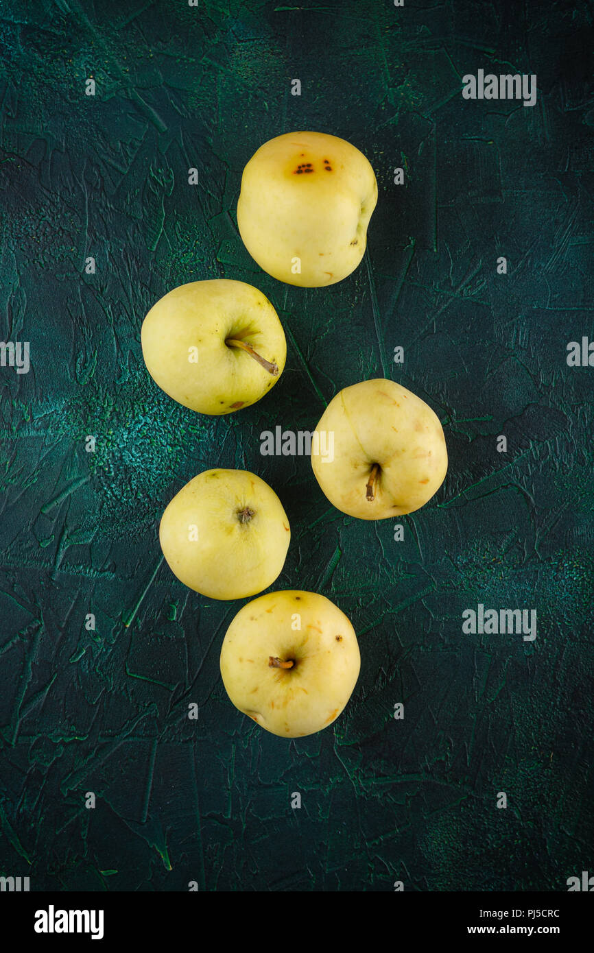 Fresh green apples on dark green background Stock Photo