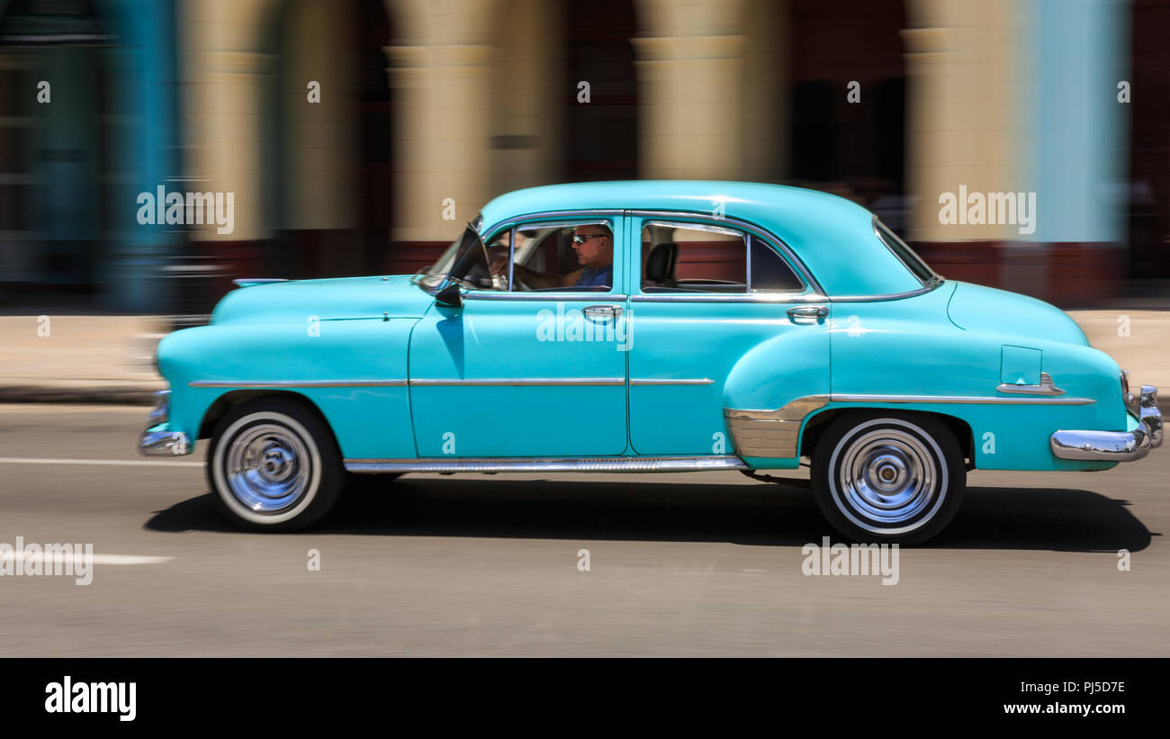 Blue 1950s American classic car, panning motion blur shot in Havana, Cuba Stock Photo