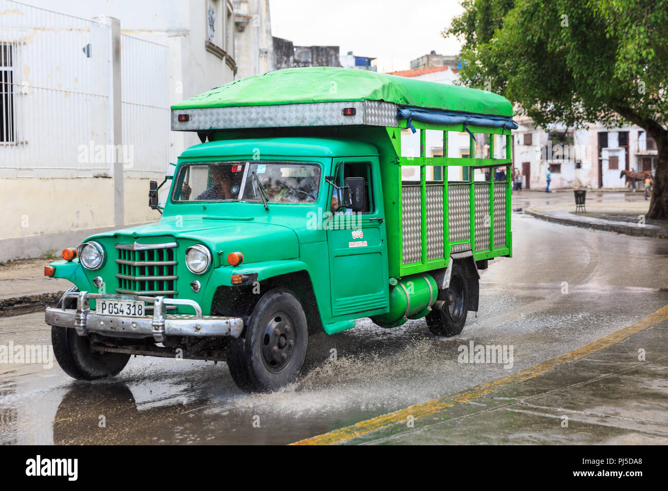 Vintage green American truck in rain, transport in Havana, Cuba Stock