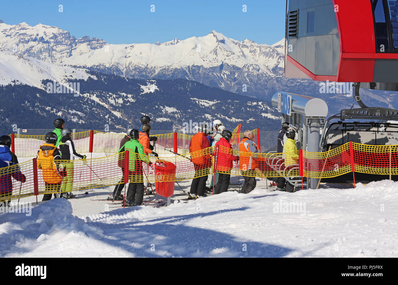 skier waiting in line for transport with lift Stock Photo