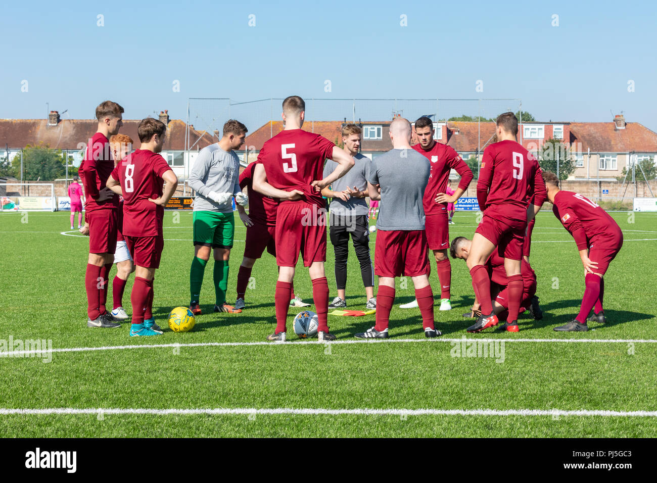 Lancing, England; 2nd September 2018; Manager gives Team Talk to Group of Male Football Players Prior to a Match Stock Photo