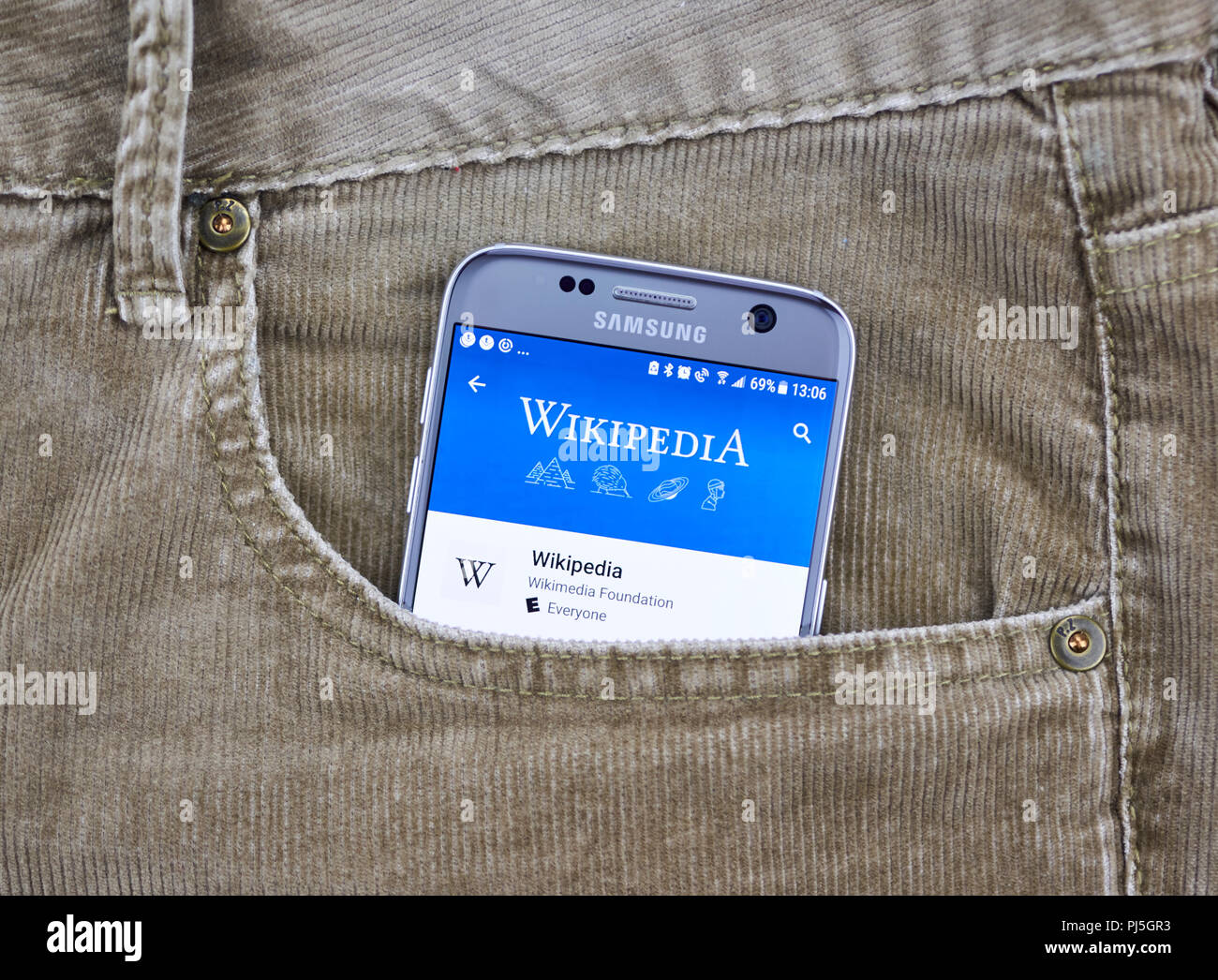 MONTREAL, CANADA - OCTOBER 10, 2017: Wikipedia mobile application on a cellphone screen in a jeans pocket. Wikipedia is a multilingual free encycloped Stock Photo