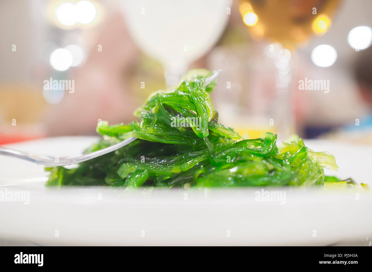 Wakame salad on plate. Japanese style food Stock Photo