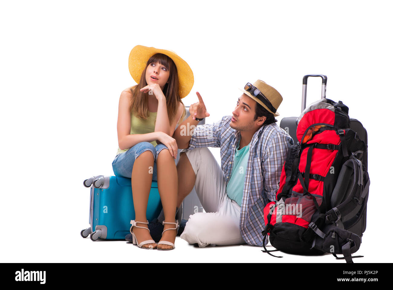 Young family preparing for vacation travel on white Stock Photo