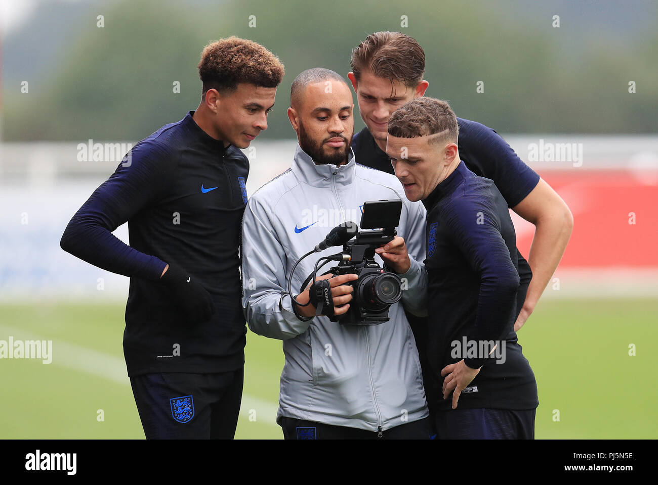 England's Dele Alli, James Tarkowski and Kieran Trippier look at video
