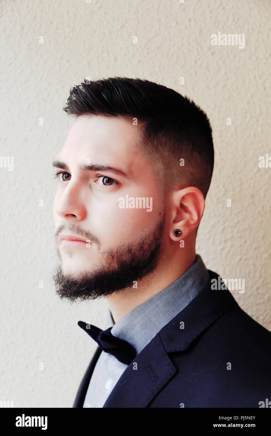 Portrait Of A Handsome Boy With A Beard Dressed Smartly Stock