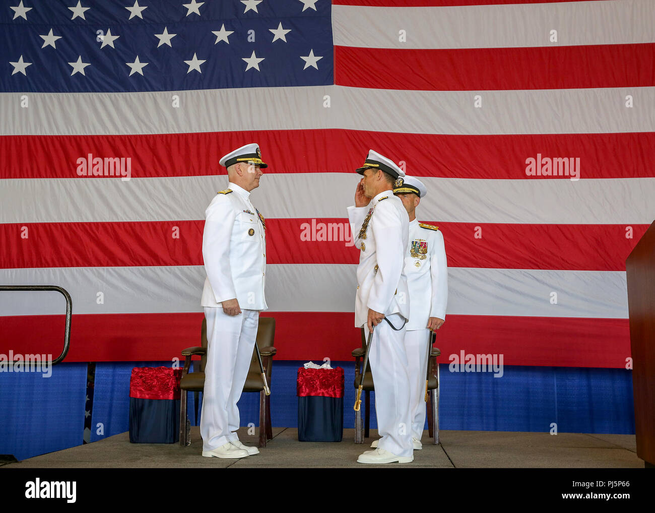 180824-N-IK388-0042 NORFOLK (Aug. 24, 2018) Vice Adm. Andrew “Woody” Lewis, right, salutes Adm. Chris Grady, commander, U.S. Fleet Forces Command, as he assumes command of U.S. 2nd Fleet aboard the nuclear aircraft carrier USS George H.W. Bush (CVN 77). U.S. 2nd Fleet will exercise operational and administrative authorities over assigned ships, aircraft and landing forces on the East Coast and North Atlantic. (U.S. Navy photo Mass Communication Specialist 2nd Class Stacy M. Atkins Ricks/Released) Stock Photo