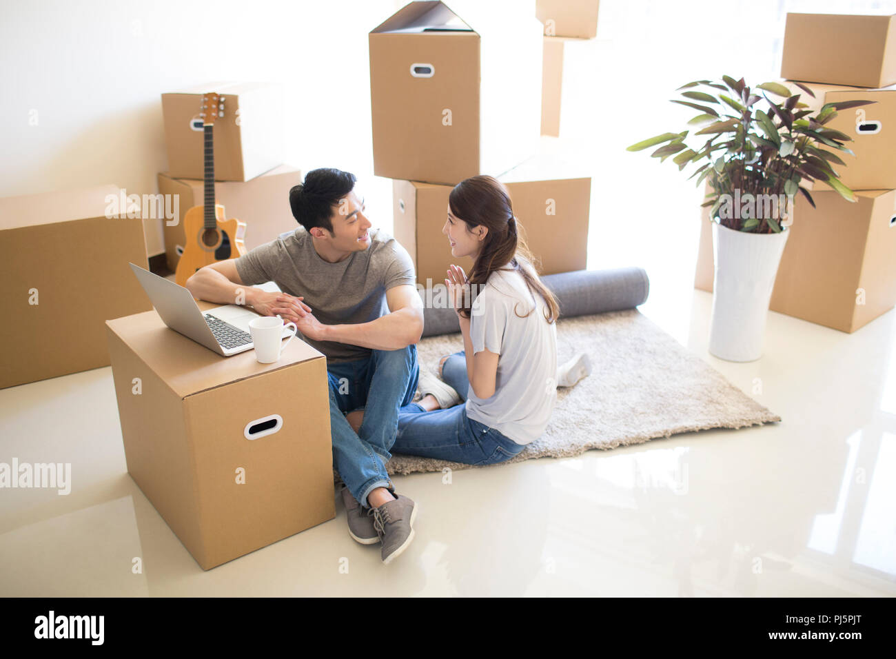 Happy young couple moving to a new house Stock Photo - Alamy
