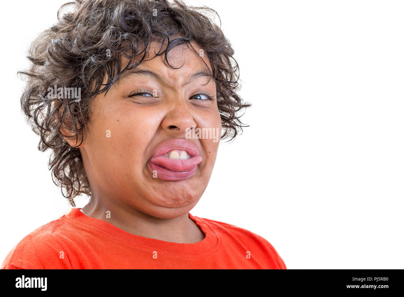 grimace of disgust. portrait of young boy grimacing of disgusty isolated on white background Stock Photo