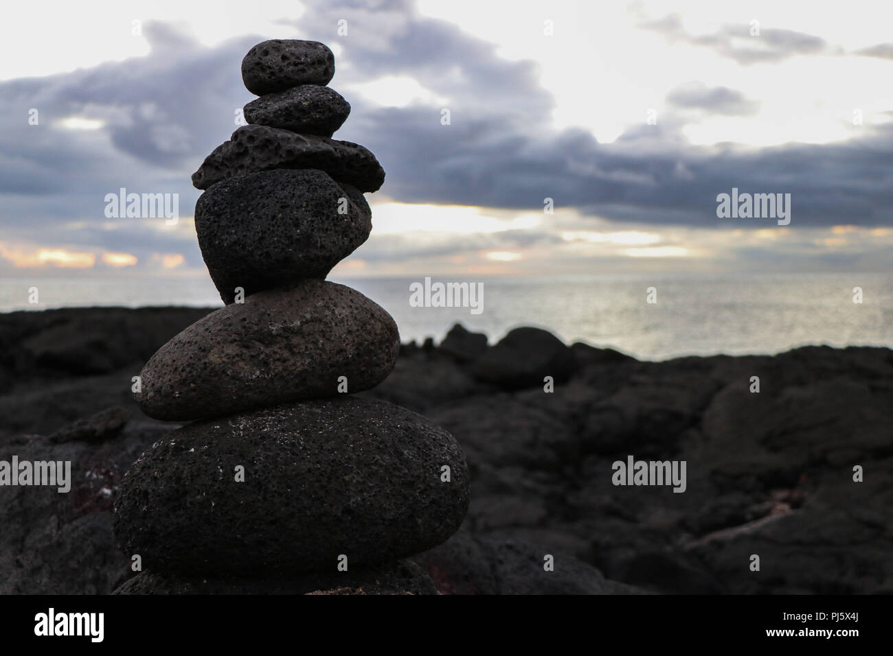 Statue of volcanic rocks, great balance on the coast of Pico island, Azores, Portugal Stock Photo