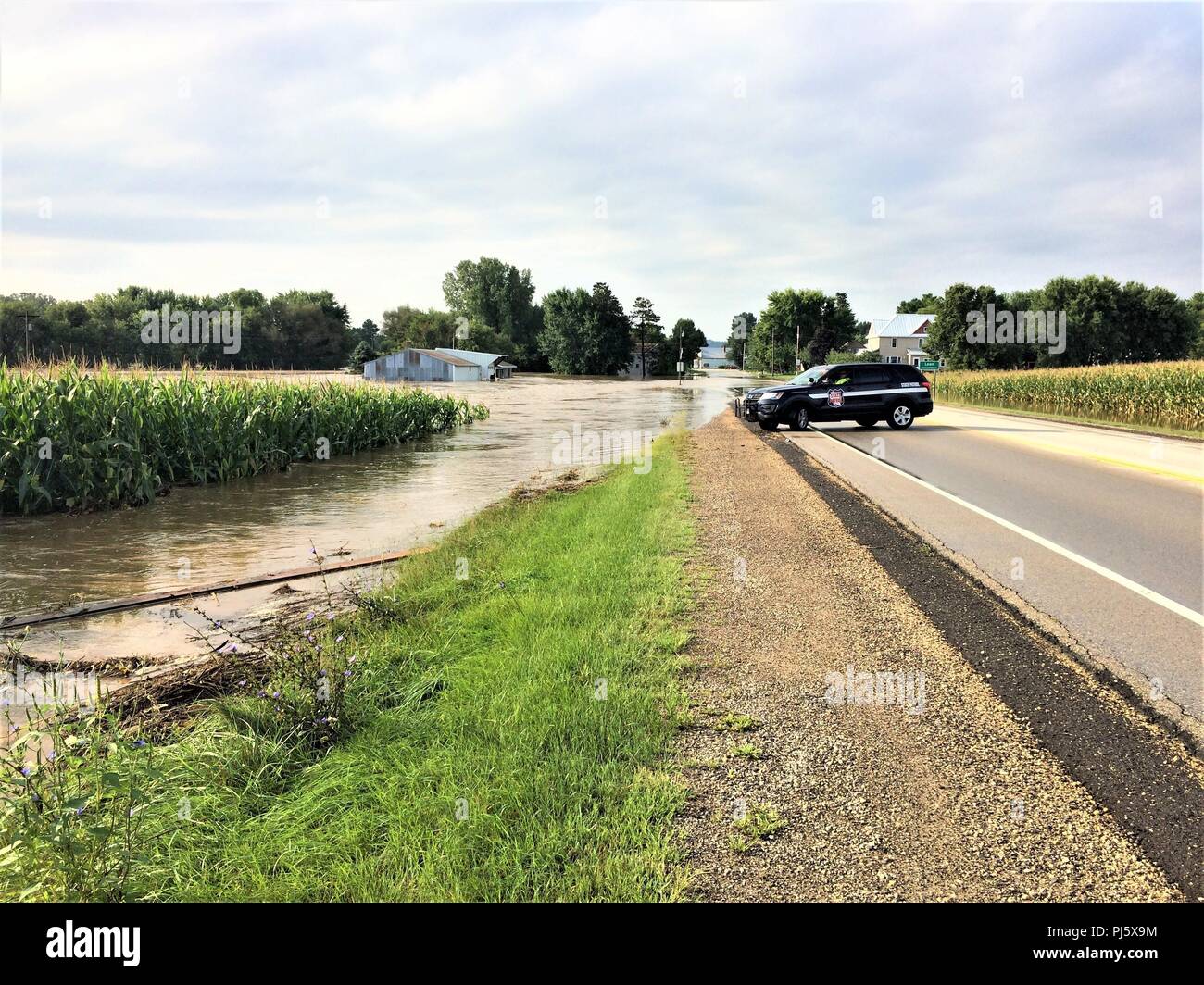 An area of Leon, Wis., shows flooding Aug, 28, 2018 in Monroe County, Wis. Firefighters with the Directorate of Emergency Services Fire Department at Fort McCoy, Wis., helped with rescue operations for the flooding. On Aug. 27 to early Aug. 28, 2018, 5-12 inches of rain fell on several areas of Monroe County, causing flash flooding and stranding residents in flooded areas. Fort McCoy firefighters helped with the rescue of people in the affected areas. (U.S. Army Photo by Scott T. Sturkol, Public Affairs Office, Fort McCoy, Wis.) Stock Photo