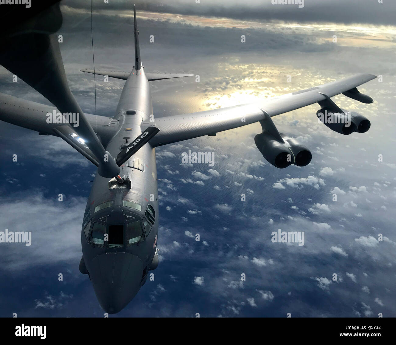 A U.S. Air Force KC-135 Stratotanker, assigned to the 506th Expeditionary Air Refueling Squadron, refuels a B-52 Stratofortress over the Indian Ocean June 10, 2018. The 506th EARS is a permanently assigned unit comprised of Air National Guard, Reserve and Active Duty KC-135 Stratotanker units from across the states. (U.S. Air Force photo by Airman 1st Class Gerald R. Willis) Stock Photo