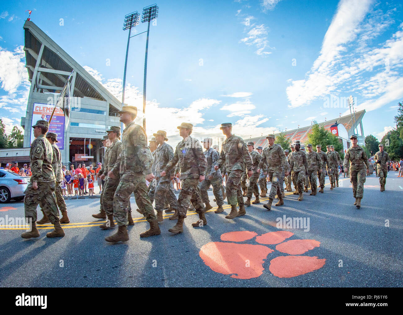 A formation of Clemson University Army ROTC cadets marches past the