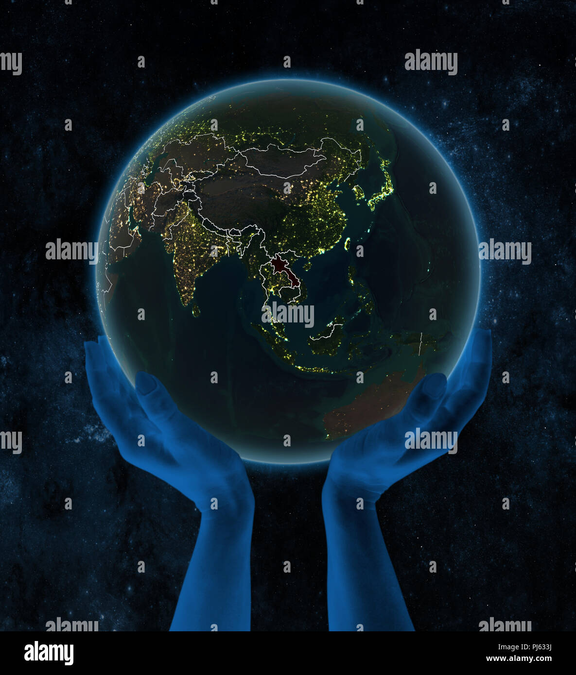 Laos on night planet Earth with visible country borders in hands in