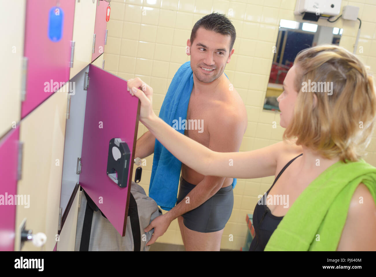 Man And Woman Chatting In Locker Room Stock Photo 217723092