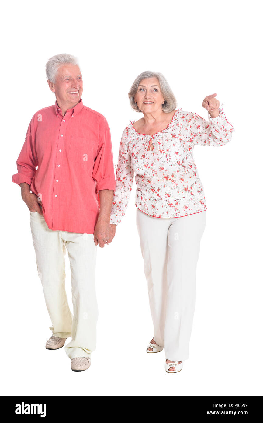 portrait of senior couple holding hands on white background Stock Photo ...
