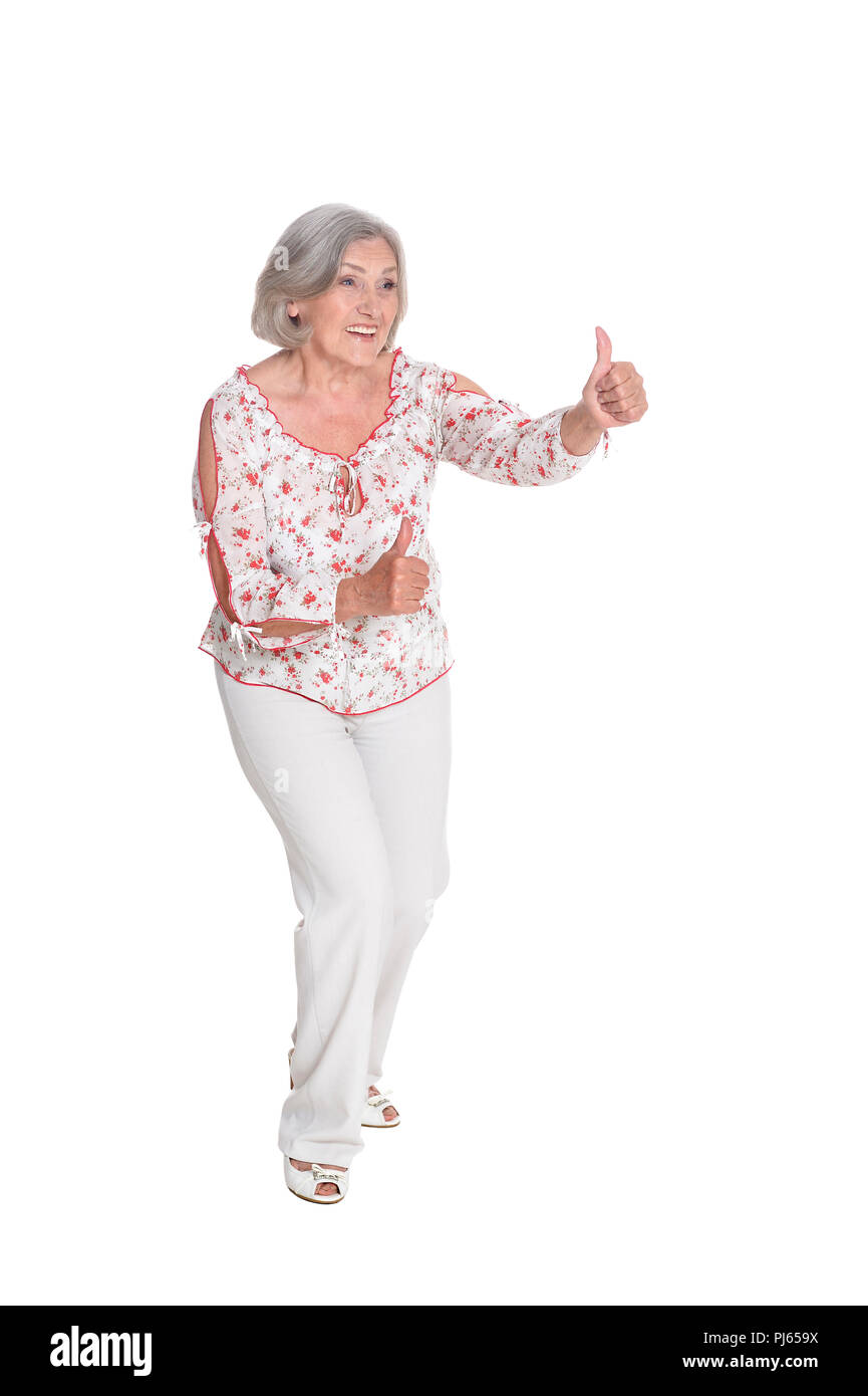 portrait of beautiful senior woman showing thumbs up Stock Photo - Alamy