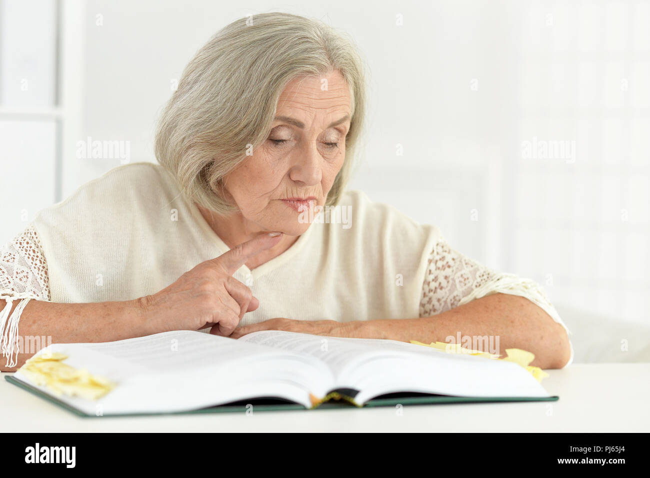 Portrait of beautiful senior woman read book Stock Photo