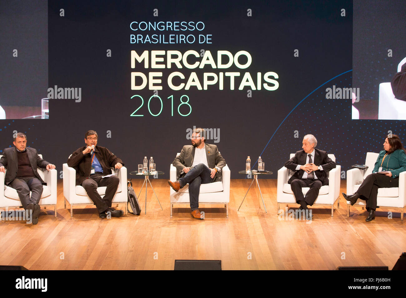 SÃO PAULO, SP - 04.09.2018: ECONOMISTAS FALAM EM EVENTO EM SP - Representatives and heads of government plans of some of the main candidates for the presidency of the republic participated, on Tuesday night (04), an event promoted by companies in the financial market in São Paulo. In the photo, economists Nelson Marconi (PDT), Marcio Pochmann (PT), Diogo Costa (NOVO) and Persio Arida (PSDB). (Photo: Bruno Rocha/Fotoarena) Stock Photo
