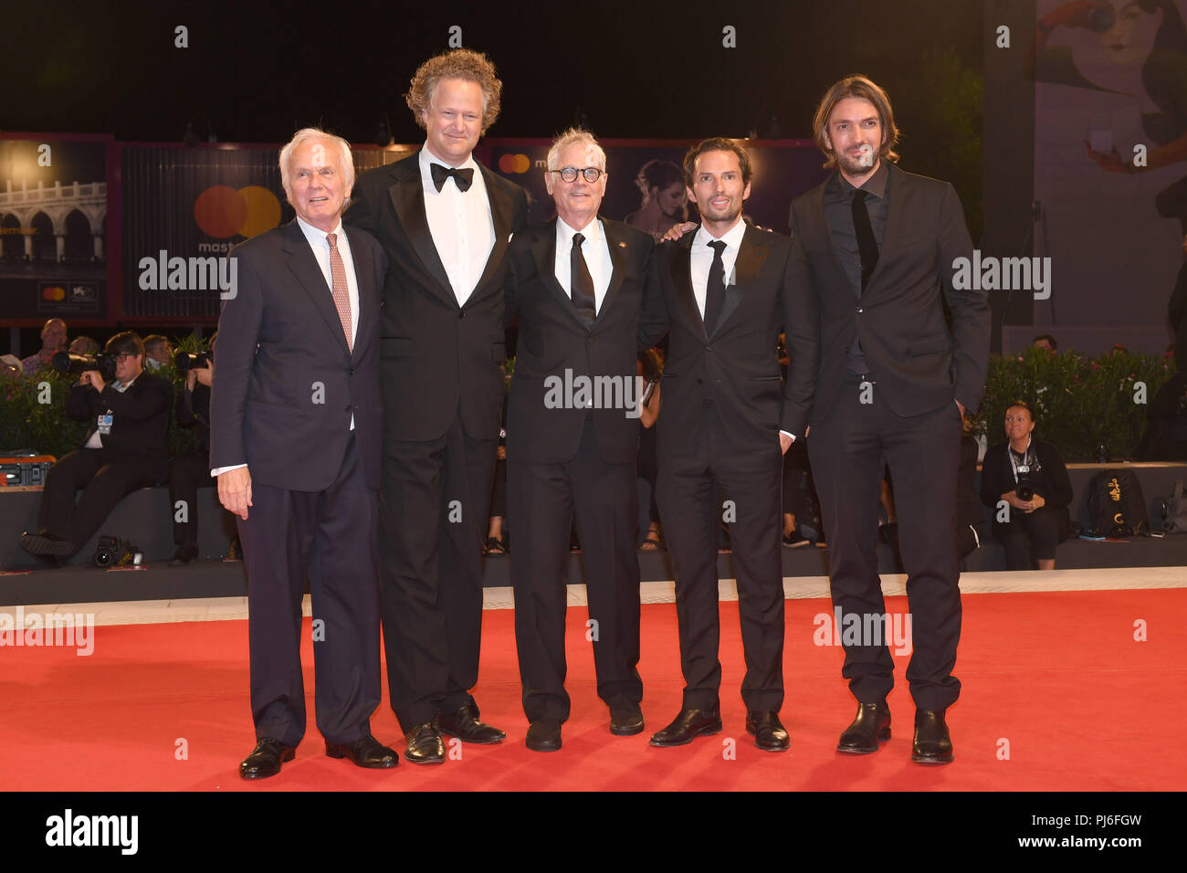 04.09.2018, Italy, Venice: Producer Jan Mojto (l-r), director Florian Henckel von Donnersmarck, cameraman Caleb Deschanel and producers Quirin Berg and Max Wiedemann can be seen at the premiere of the film 'Work Without Author' (Never Look Away) at the Venice Film Festival on the red carpet. The film festival runs from 29 August to 8 September and is taking place for the 75th time this year. Photo: Felix Hörhager/dpa Stock Photo