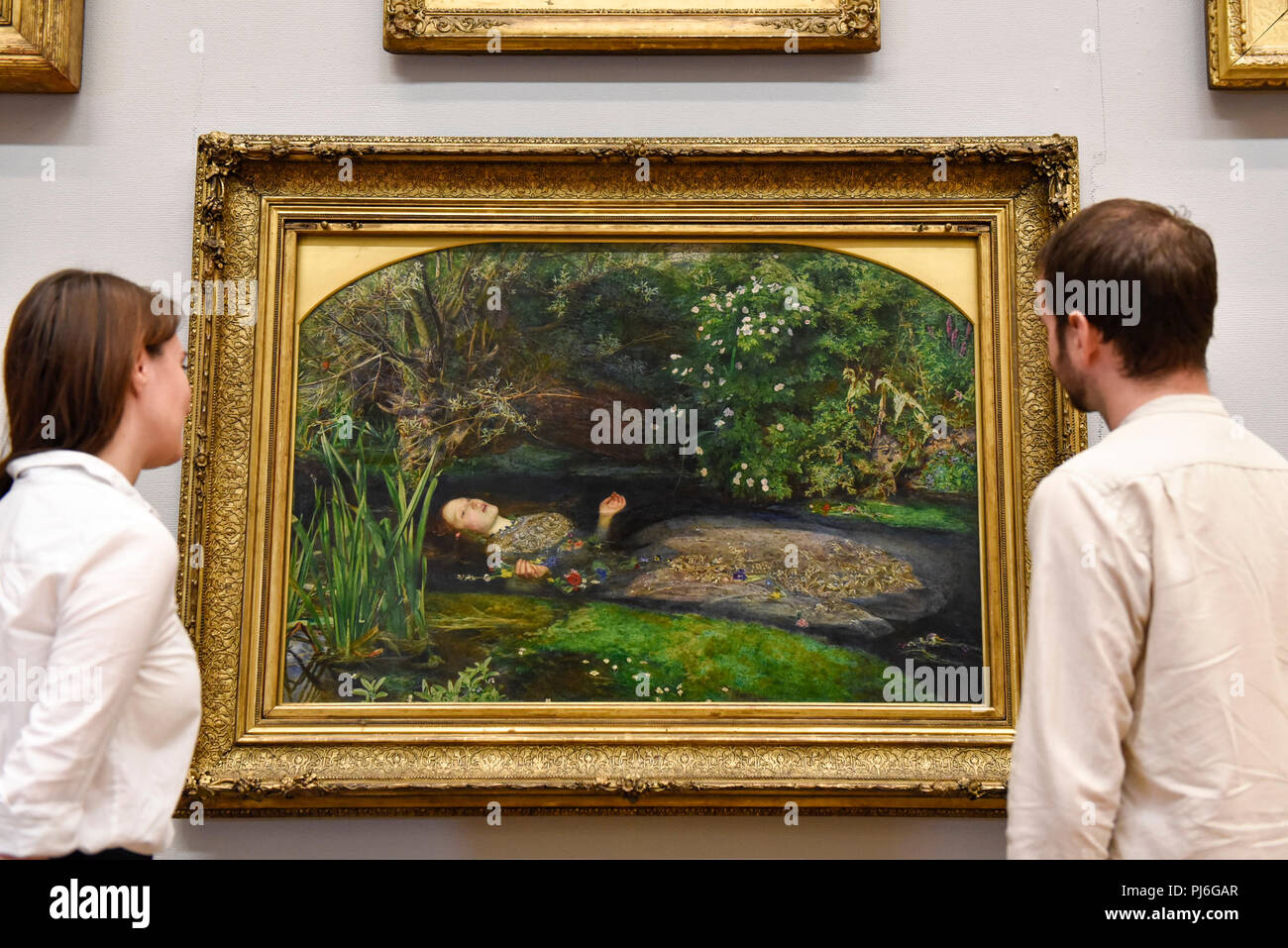 London, UK.  5 September 2018.  Staff members view 'Ophelia', 1851-52, by John Everett Millais, at Tate Britain, to mark the launch of a major new exhibition at the National Gallery of Australia (NGA) in December 2018.  Over forty Pre-Raphaelite works will be loaned by Tate to NGA, which have never been shown in Australia until now, including 'Ophelia', 1851-52, by John Everett Millais and 'The Lady of Shalott', 1888, by John William Waterhouse. Credit: Stephen Chung / Alamy Live News Stock Photo