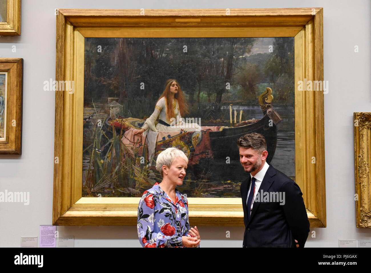 London, UK.  5 September 2018.  Maria Balshaw, Director of Tate, and Nick Mitzevich, Director of the National Gallery of Australia, pose with 'The Lady of Shalott', 1888, by John William Waterhouse, at Tate Britain, to mark the launch of a major new exhibition at the National Gallery of Australia (NGA) in December 2018.  Over forty Pre-Raphaelite works will be loaned by Tate to NGA, which have never been shown in Australia until now, including 'Ophelia', 1851-52, by John Everett Millais and 'The Lady of Shalott', 1888, by John William Waterhouse. Credit: Stephen Chung / Alamy Live News Stock Photo