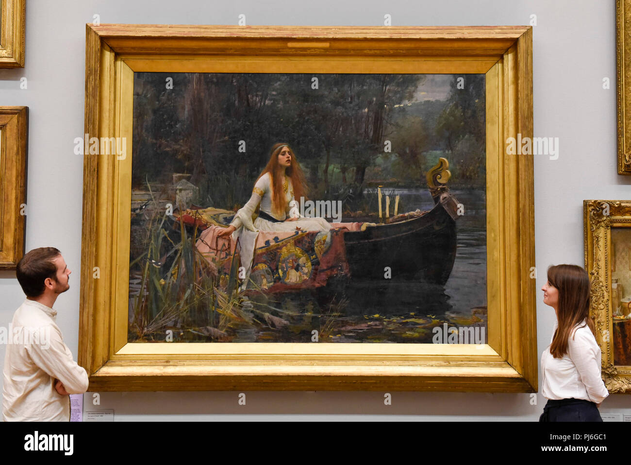 London, UK.  5 September 2018.  Staff members view 'The Lady of Shalott', 1888, by John William Waterhouse, at Tate Britain, to mark the launch of a major new exhibition at the National Gallery of Australia (NGA) in December 2018.  Over forty Pre-Raphaelite works will be loaned by Tate to NGA, which have never been shown in Australia until now, including 'Ophelia', 1851-52, by John Everett Millais and 'The Lady of Shalott', 1888, by John William Waterhouse. Credit: Stephen Chung / Alamy Live News Stock Photo