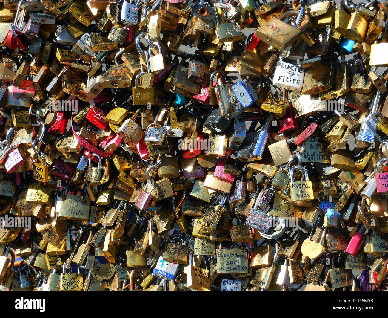 Hundreds of Padlocks and messages fixed to a bridge over the River