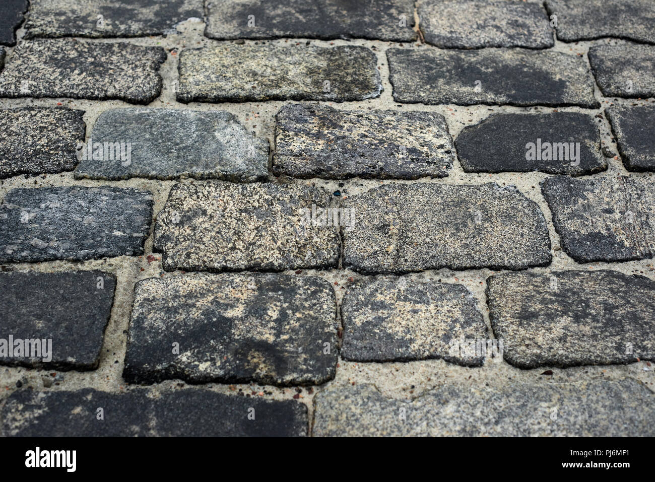 old cobblestone road for background or texture Stock Photo - Alamy