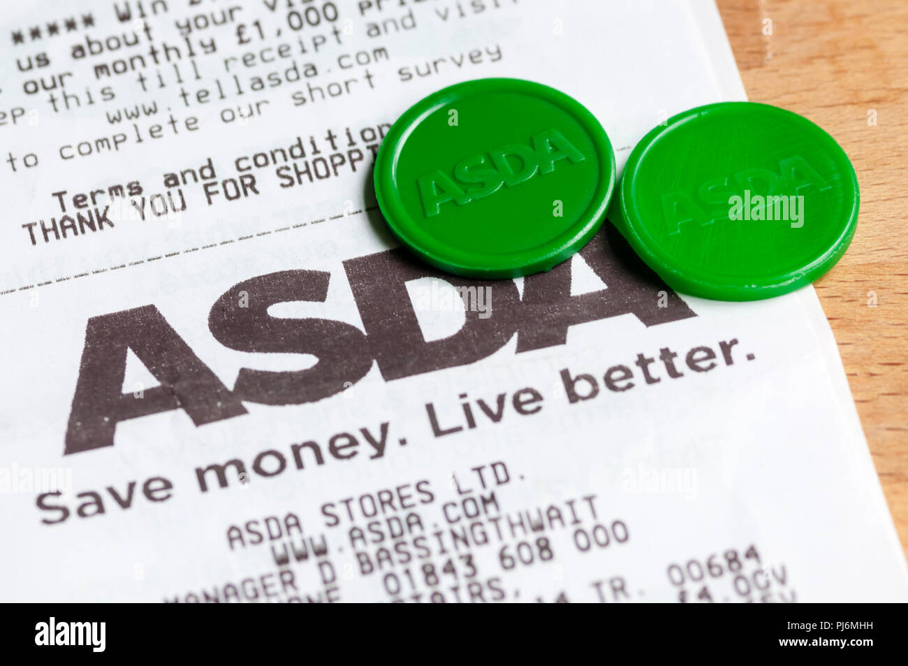 Asda Foundation green tokens, which customer's earn on each shop and donate to selected charities. Stock Photo
