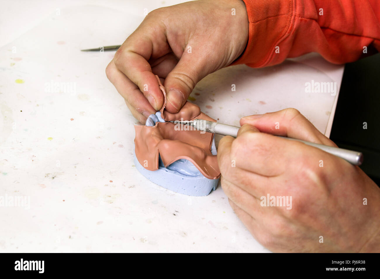 Trimming with scalpel Shellac base plates. Dentures. Dental prosthesis