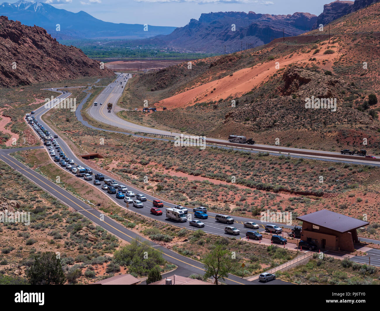 Cars lined up at the entrance fee station, Arches National Park, Moab