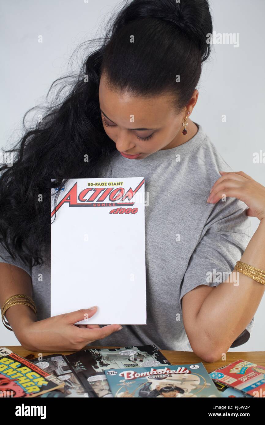 black girl with Action comics special 1000 issue Stock Photo