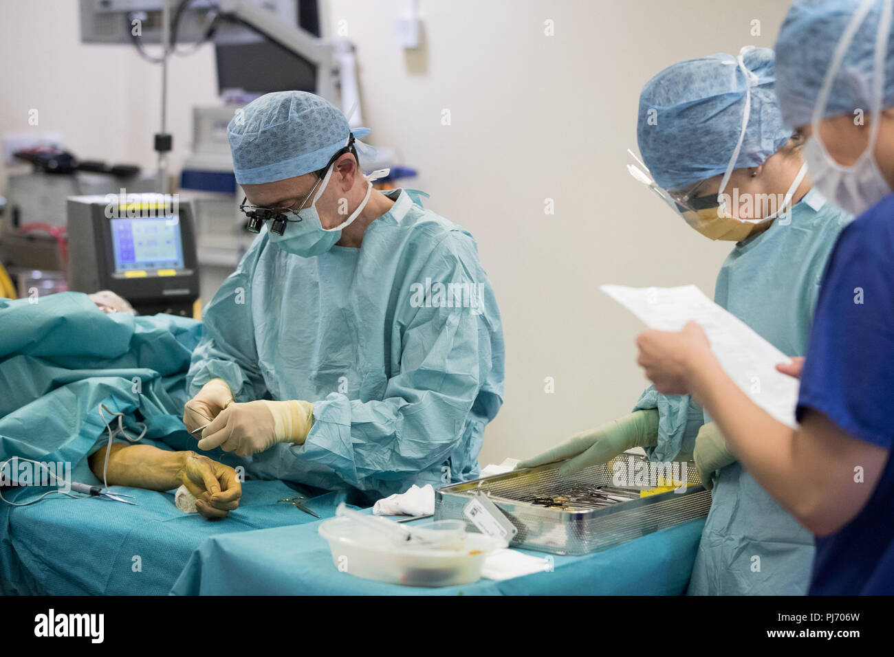 Carlos Heras-Palou, 53, performing hand surgery at Derby Nuffield Hospital. Mr Heras-Palou, an orthopaedic specialist surgeon, may have had his career saved by a new drug called 'Patisiran'. The rare disease, hereditary transthyretin-mediated amyloidosis (hATTR amyloidosis), progressed and destroyed the nerves in his hands, rendering them useless. However after an 18 month course of Patisiran the condition has halted and reversed. Stock Photo