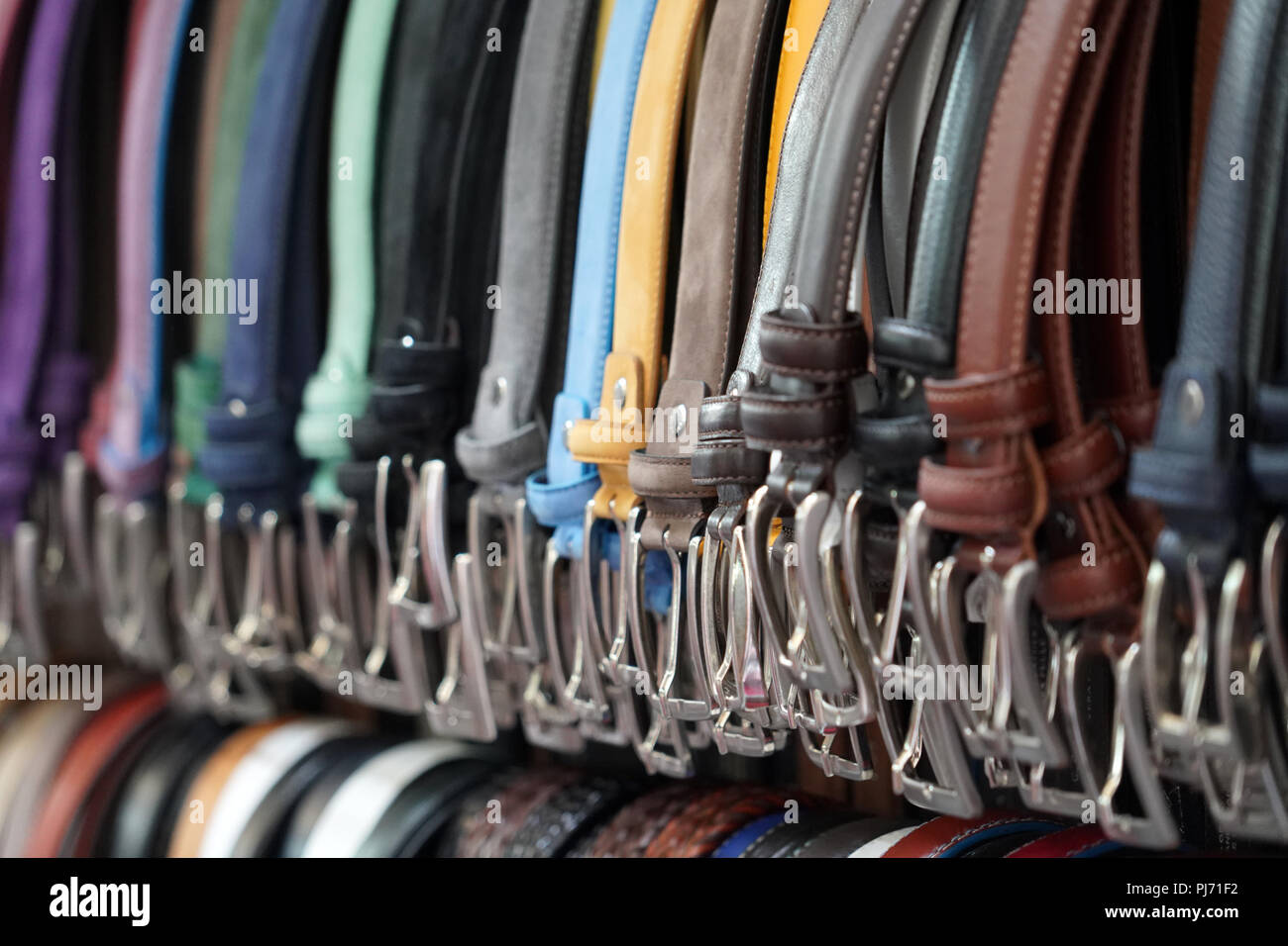 different colors leather belt on display at the market for sale Stock ...