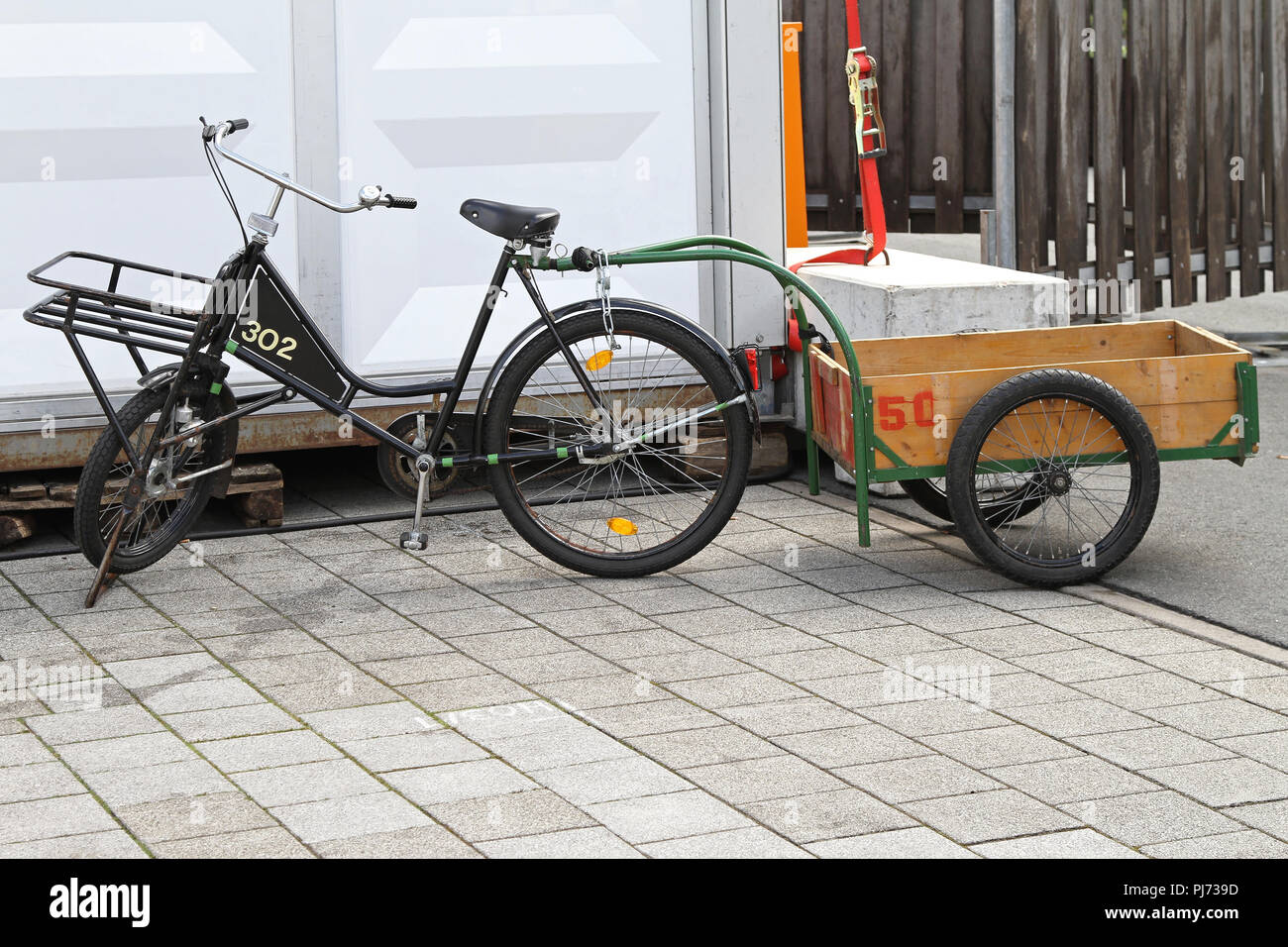 Freight bicycle with cargo trailer for heavy loads delivery Stock Photo