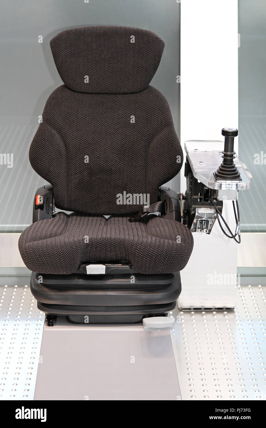 Ergonomic Seat with Joystick Controls for Construction Machinery Stock Photo