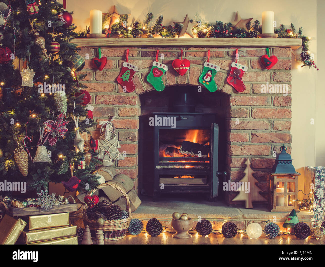 Christmas Setting Decorated Fireplace With Woodburner Lit Up