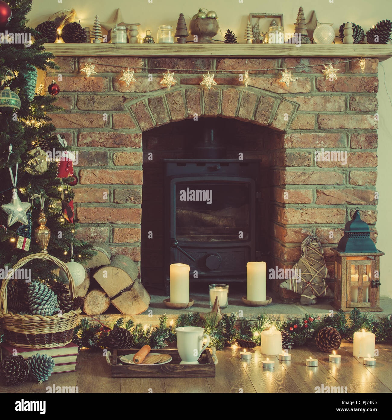Decorated Fireplace Lit Up Christmas Tree With Baubles And